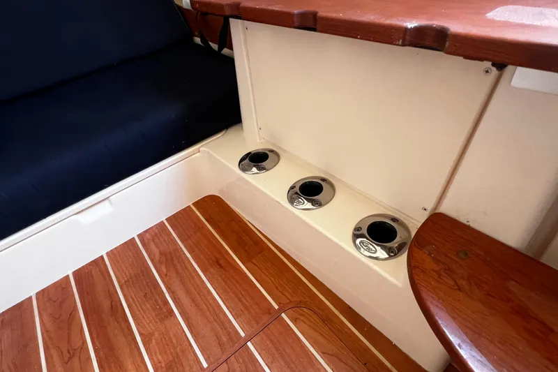 Slide: The Image of Interior of 2021 Grady-White Canyon 336 boat with wooden flooring and seating. - 63