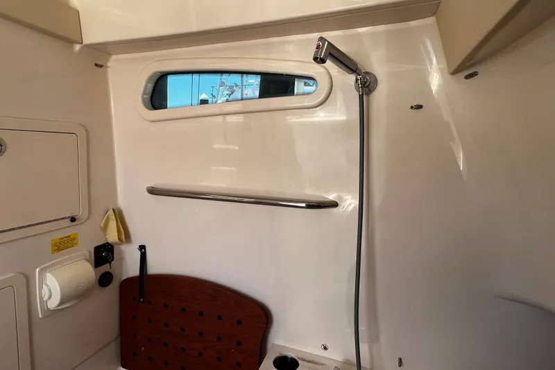 Slide: The Image of Interior of 2021 Grady-White Canyon 336 boat, featuring a shower area with window. - 65