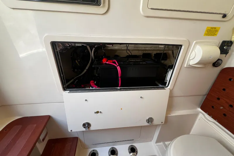 Slide: The Image of 2021 Grady-White Canyon 336 boat interior showing open electrical compartment. - 68
