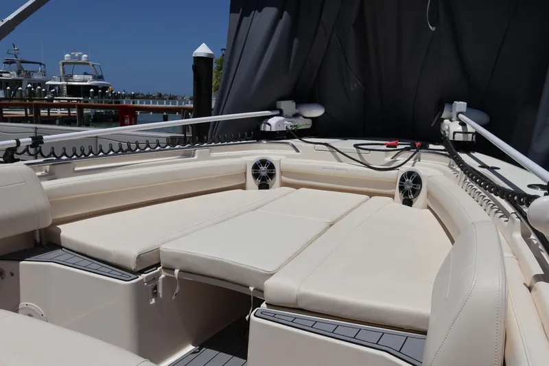Slide: The Image of 2021 Grady-White Canyon 336 boat interior with cushioned seating and marine equipment. - 72