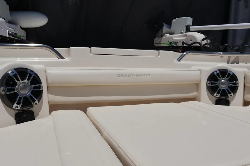 Slide: The Image of 2021 Grady-White Canyon 336 boat interior with speakers and seating. - 73