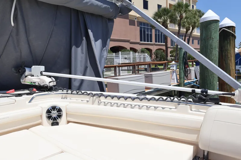 Slide: The Image of 2021 Grady-White Canyon 336 boat interior with fishing equipment at a marina. - 78