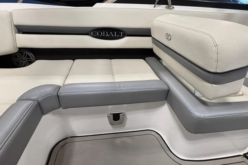 Slide: The Image of 2021 Cobalt CS23 boat interior with gray and white seating. - 10