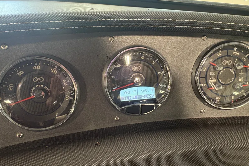 Slide: The Image of Dashboard of a 2021 Cobalt CS23 boat showing speedometer, tachometer, and temperature display. - 13