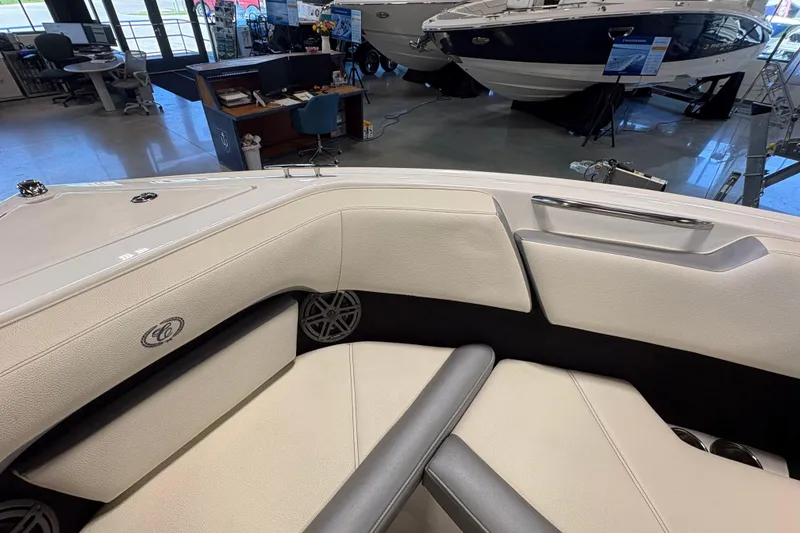 Slide: The Image of Interior view of a 2021 Cobalt CS23 boat in a showroom setting. - 17