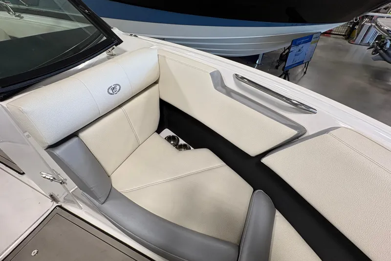 Slide: The Image of 2021 Cobalt CS23 boat interior with white and gray seating, featuring a sleek design. - 18