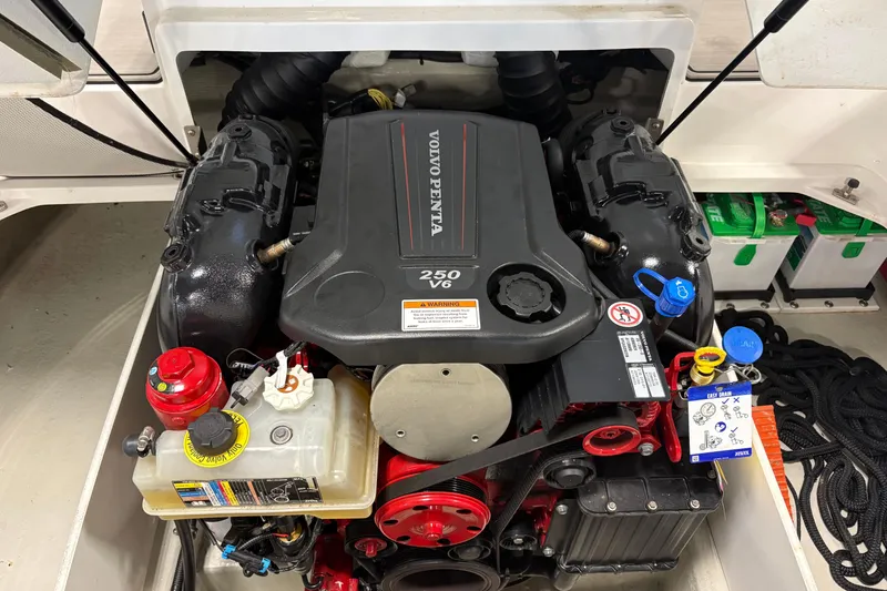 Slide: The Image of 2021 Cobalt CS23 boat engine compartment featuring a Volvo Penta 250 V6 engine. - 3