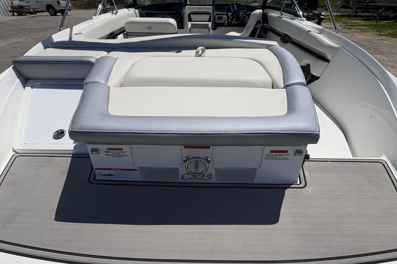 Slide: The Image of 2021 Cobalt CS23 boat interior with cushioned seating and sleek design. - 7