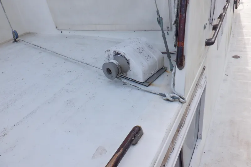 Slide: The Image of Deck of 1980 Grand Banks 49 Classic yacht with winch and ropes. - 10