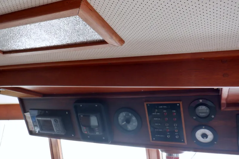 Slide: The Image of Interior dashboard of a 1980 Grand Banks 49 Classic yacht, featuring navigation instruments. - 22