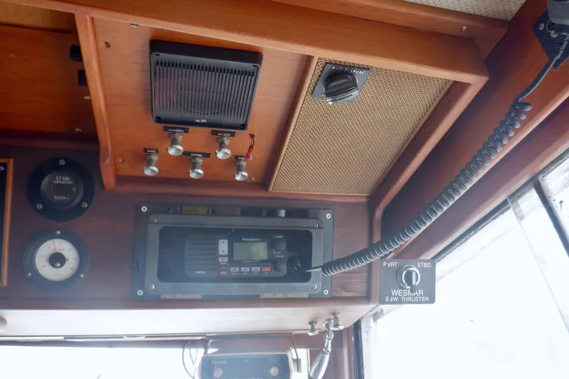 Slide: The Image of Control panel of a 1980 Grand Banks 49 Classic boat with navigation instruments. - 23