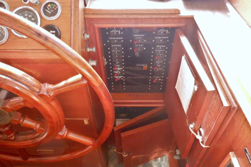 Slide: The Image of Wooden helm and control panel of 1980 Grand Banks 49 Classic yacht. - 24