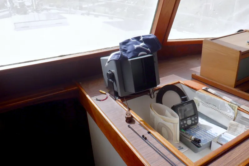 Slide: The Image of Interior of 1980 Grand Banks 49 Classic yacht with navigation equipment and wooden finish. - 27