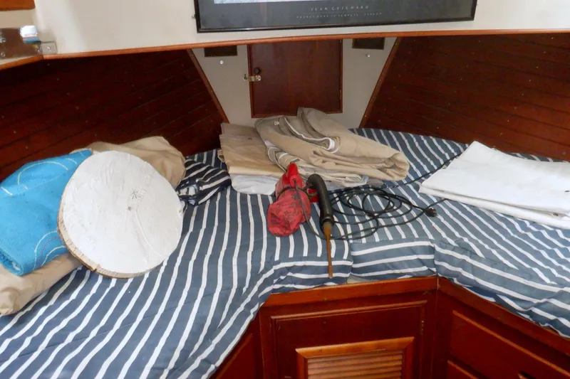 Slide: The Image of Interior of 1980 Grand Banks 49 Classic with striped bedding and nautical equipment. - 34