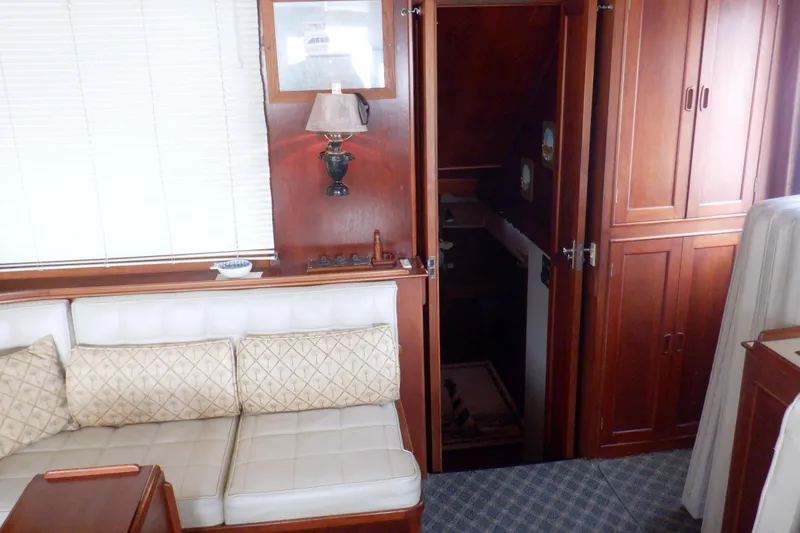 Slide: The Image of Interior of 1980 Grand Banks 49 Classic yacht with wooden cabinetry and cushioned seating. - 36