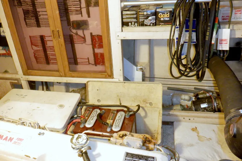 Slide: The Image of Engine room of 1980 Grand Banks 49 Classic with tools and equipment. - 53