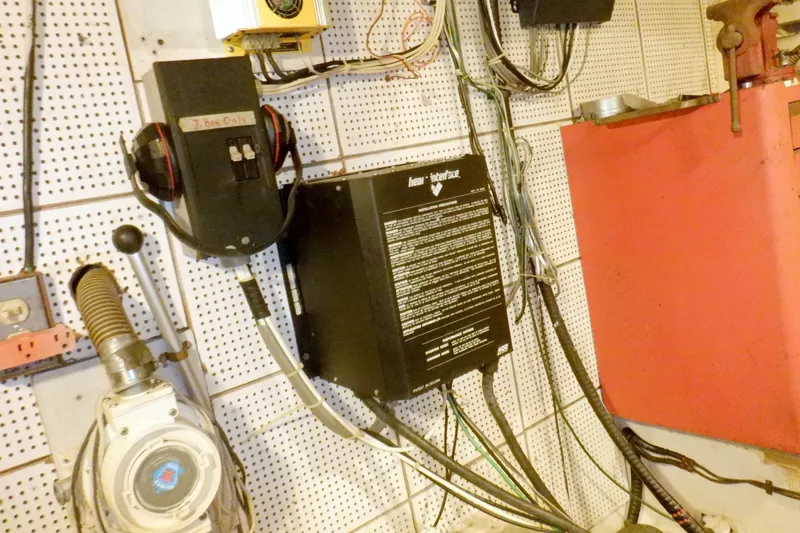 Slide: The Image of Electrical panel and wiring inside a 1980 Grand Banks 49 Classic boat. - 57