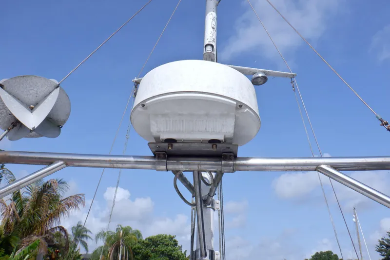 Slide: The Image of Radar equipment on a 1980 Grand Banks 49 Classic yacht against a clear blue sky. - 8