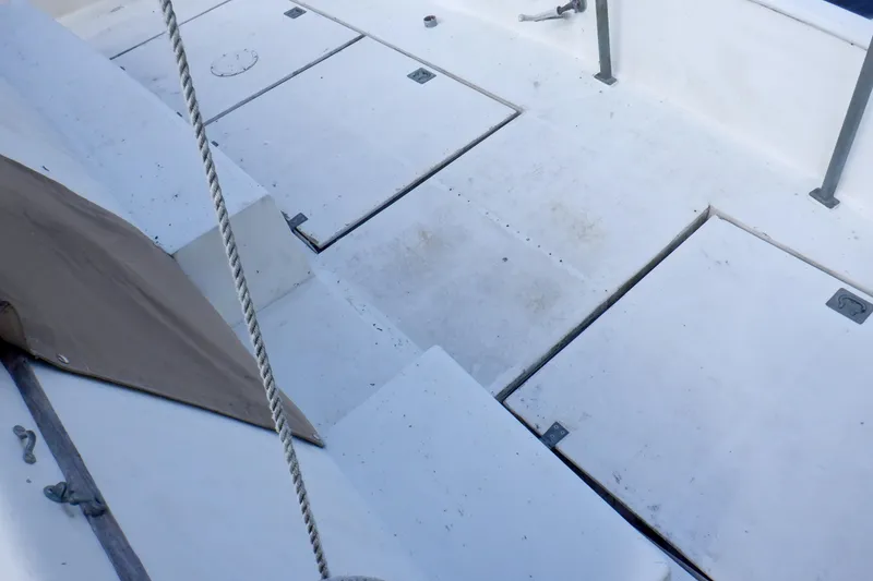 Slide: The Image of Deck of 1980 Grand Banks 49 Classic yacht with storage compartments. - 9