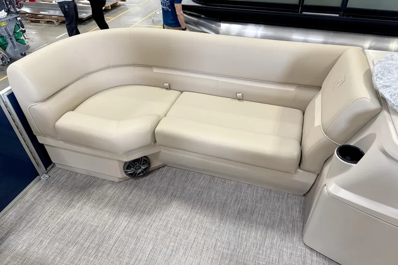 Slide: The Image of Luxurious beige seating on 2026 Godfrey EX 1880 CX boat, featuring cup holder and speaker. - 3