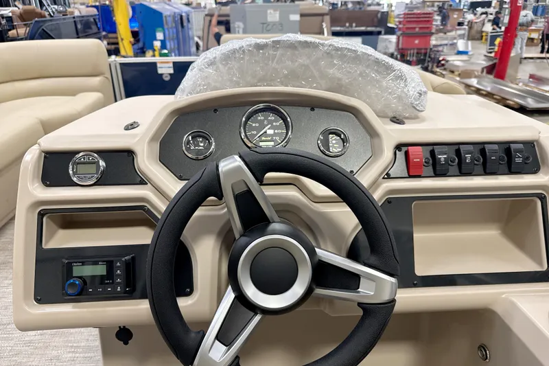 Slide: The Image of Steering console of 2026 Godfrey EX 1880 CX boat with gauges and controls. - 5