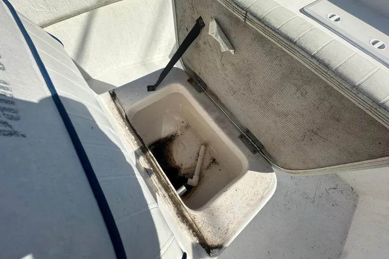 Slide: The Image of Open storage compartment on a 2004 Palm Beach 161 Whitecap boat, showing interior details. - 3