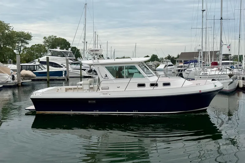 Slide: The Image of 2006 Albin 28 Tournament Express boat docked in a marina. - 14