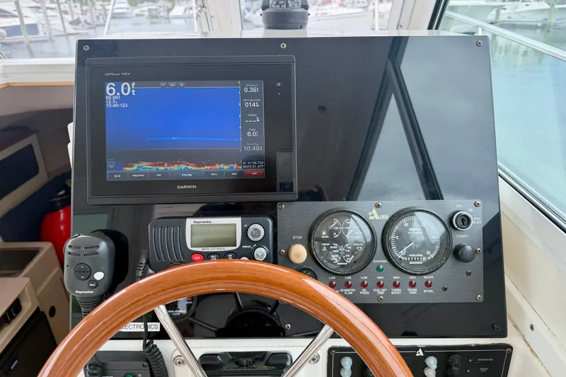 Slide: The Image of Dashboard of a 2006 Albin 28 Tournament Express with navigation and control instruments. - 27