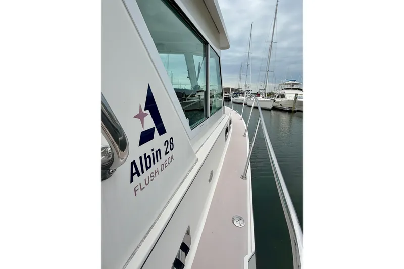Slide: The Image of 2006 Albin 28 Tournament Express boat docked in marina, side view. - 31
