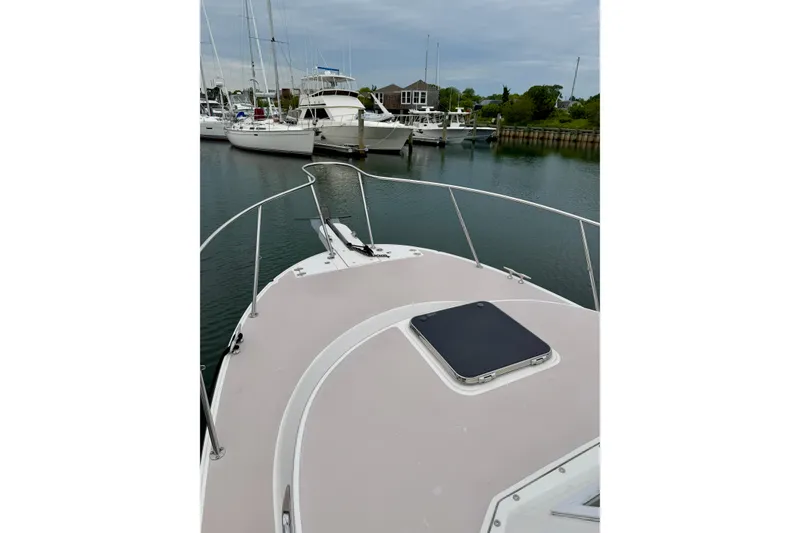 Slide: The Image of Bow view of 2006 Albin 28 Tournament Express docked in a marina. - 33