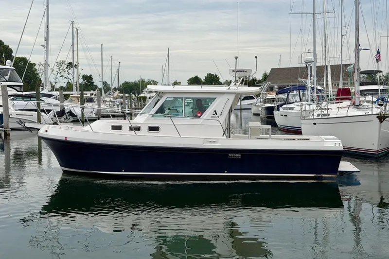 Slide: The Image of 2006 Albin 28 Tournament Express boat docked in a marina with sailboats. - 4