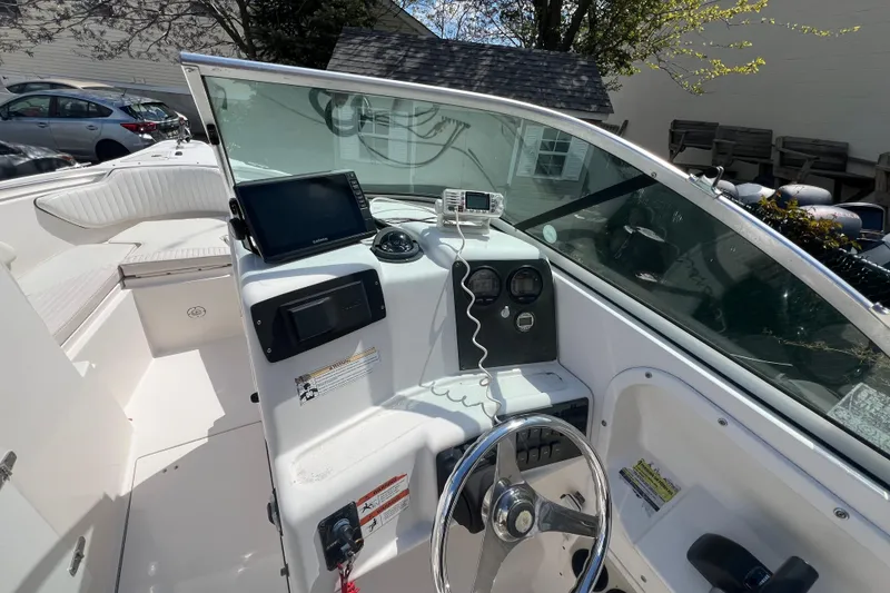 Slide: The Image of 2007 Seaswirl Striper 2301 Dual Console O/B boat interior with steering wheel and navigation equipment. - 10