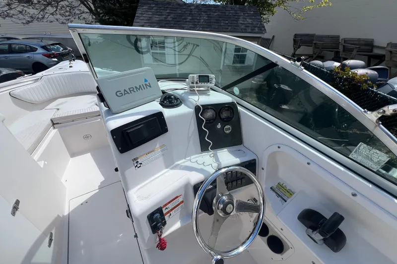 Slide: The Image of 2007 Seaswirl Striper 2301 Dual Console boat interior with Garmin navigation system. - 11
