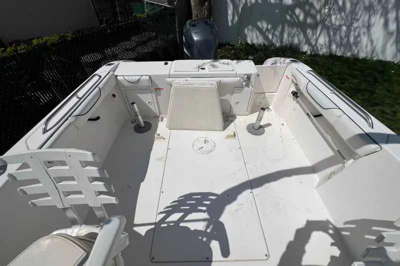 Slide: The Image of 2007 Seaswirl Striper 2301 Dual Console O/B boat interior, featuring spacious seating and storage. - 4