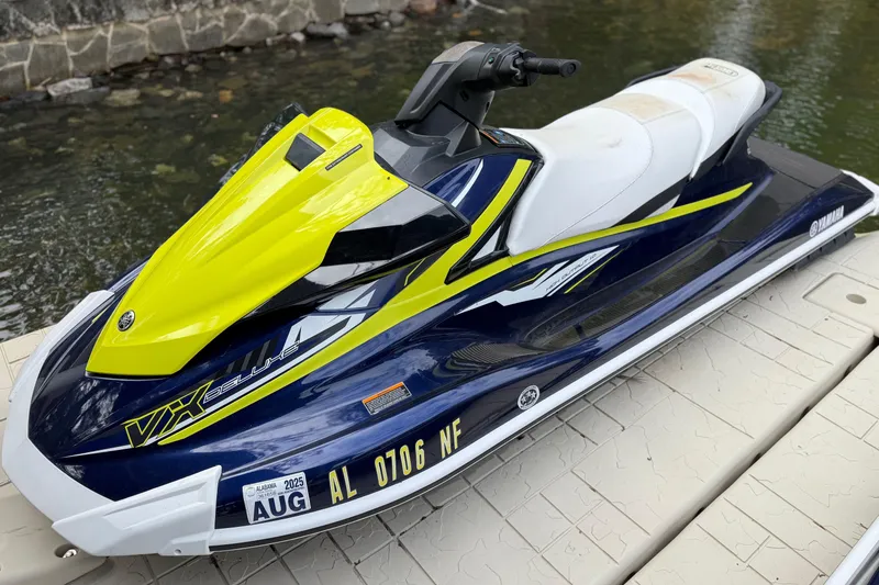 Slide: The Image of 2020 Yamaha WaveRunner VX Deluxe jet ski on dock by water. - 3