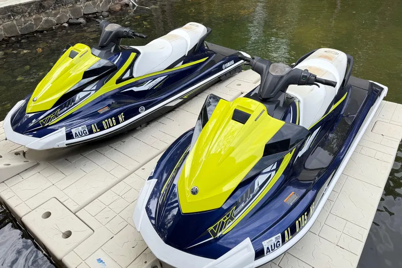 Slide: The Image of Two 2020 Yamaha WaveRunner VX Deluxe jet skis docked on a platform. - 6