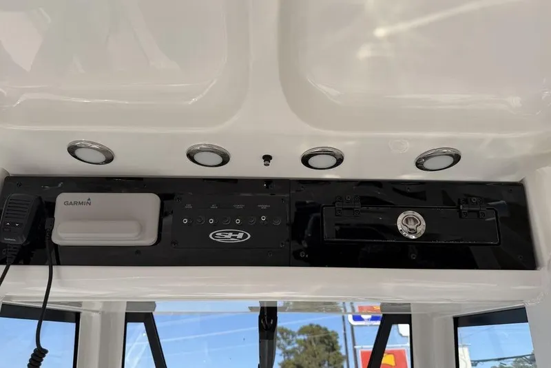 Slide: The Image of 2026 Sea Hunt Gamefish 27 dashboard with Garmin electronics and control panel. - 6
