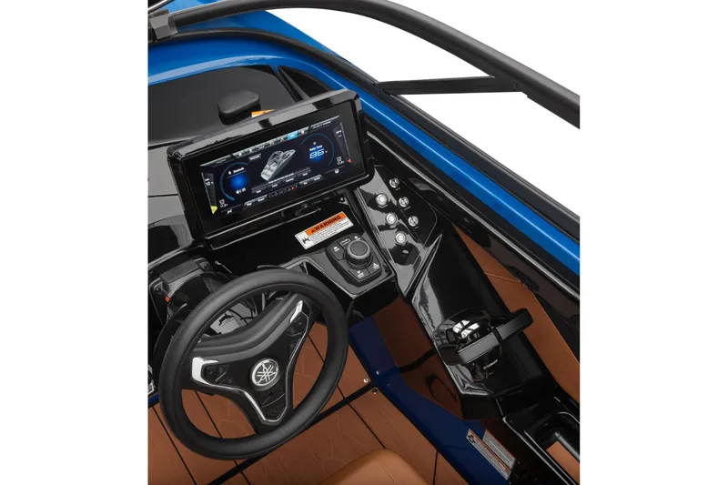 Slide: The Image of 2026 Yamaha Boats 255XD dashboard with steering wheel and digital display. - 13