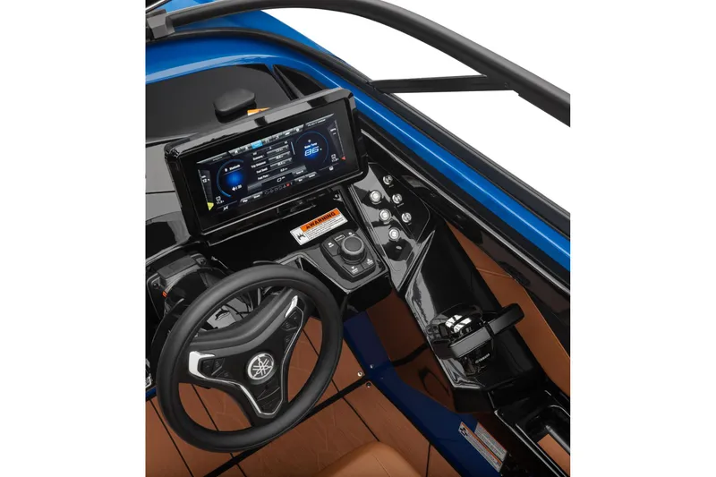 Slide: The Image of 2026 Yamaha Boats 255XD dashboard with steering wheel and digital display. - 16
