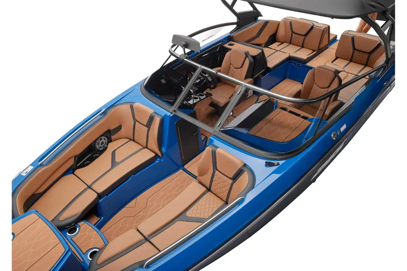 Slide: The Image of 2026 Yamaha Boats 255XD interior, featuring luxurious tan seating and sleek blue exterior. - 18