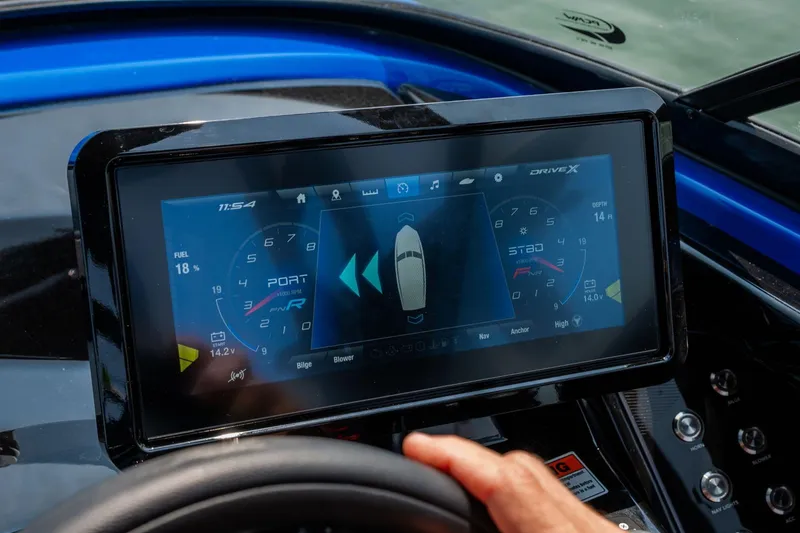 Slide: The Image of Dashboard of 2026 Yamaha Boats 255XD with digital display and navigation controls. - 30