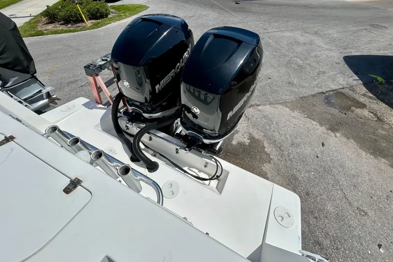 Slide: The Image of Twin Mercury outboard engines on a 2001 Contender 35 Side Console boat. - 10