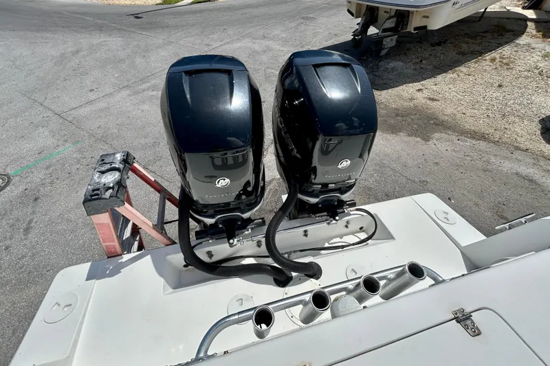 Slide: The Image of Twin Mercury outboard engines on a 2001 Contender 35 Side Console boat. - 11
