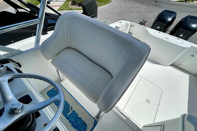 Slide: The Image of 2001 Contender 35 Side Console boat interior with steering wheel and seating area. - 18