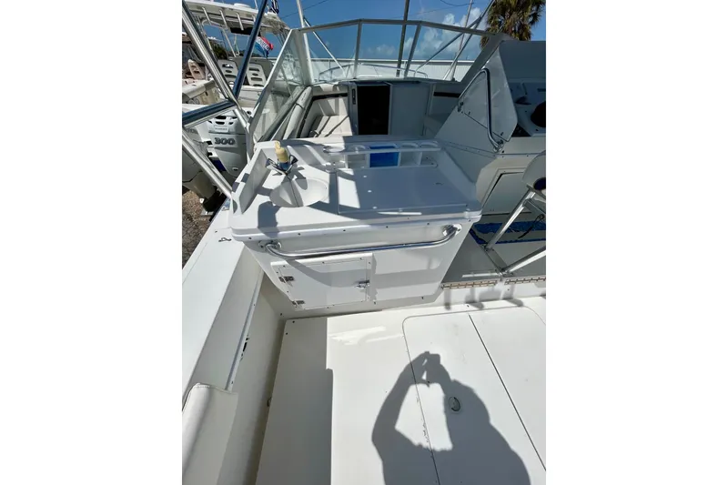 Slide: The Image of 2001 Contender 35 Side Console boat interior with helm and seating area. - 20