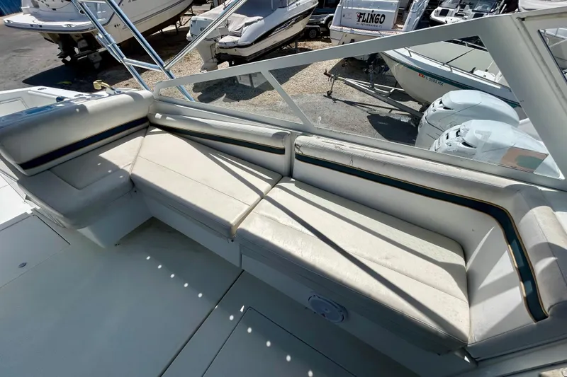 Slide: The Image of 2001 Contender 35 Side Console boat with spacious seating area and sleek design. - 22
