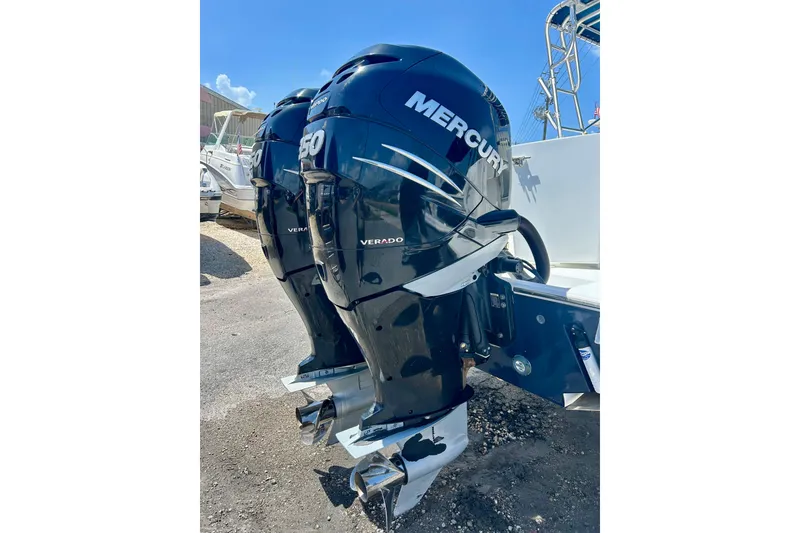 Slide: The Image of Twin Mercury Verado outboard engines on a 2001 Contender 35 Side Console boat. - 24
