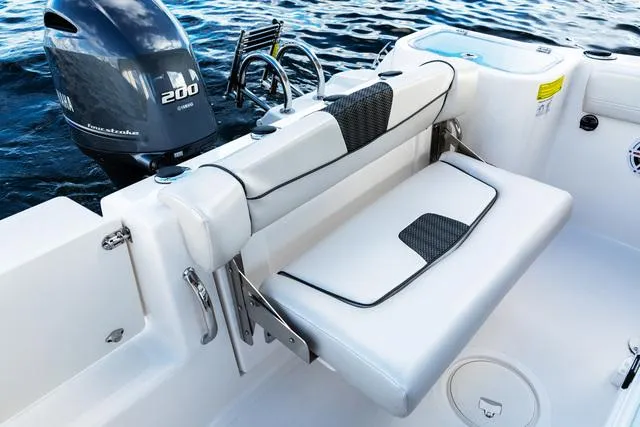 Slide: The Image of 2023 Wellcraft 222F boat interior with Yamaha 200 engine, featuring a foldable seat. - 3