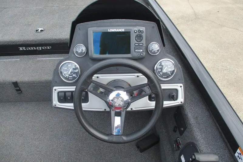 Slide: The Image of 2018 Ranger RT178 boat dashboard with steering wheel and Lowrance display. - 4