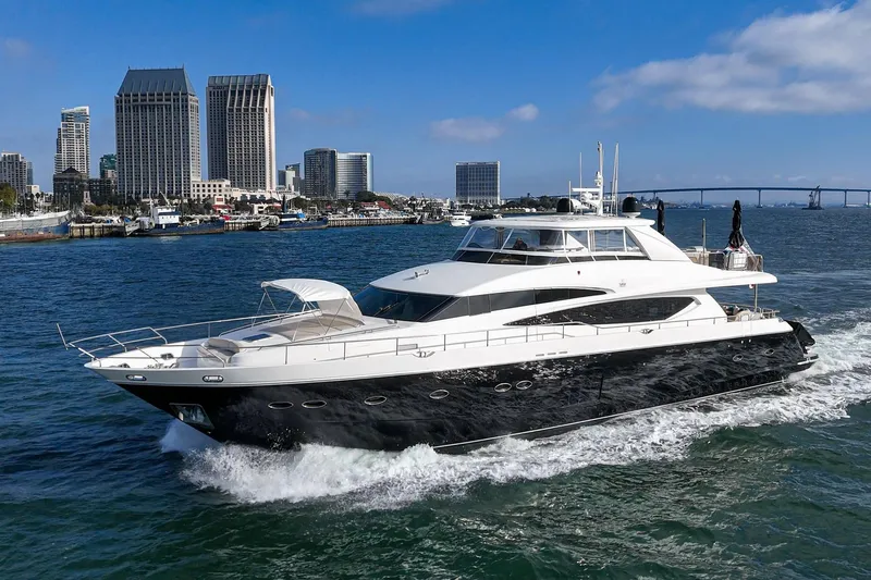 The Image of 2011 Princess 95 Motor Yacht cruising near city skyline and bridge. - 1